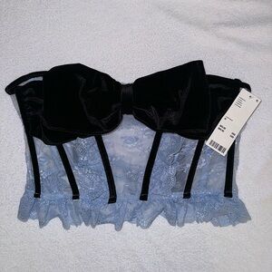 Urban Outfitters baby blue lace corset top with black bow